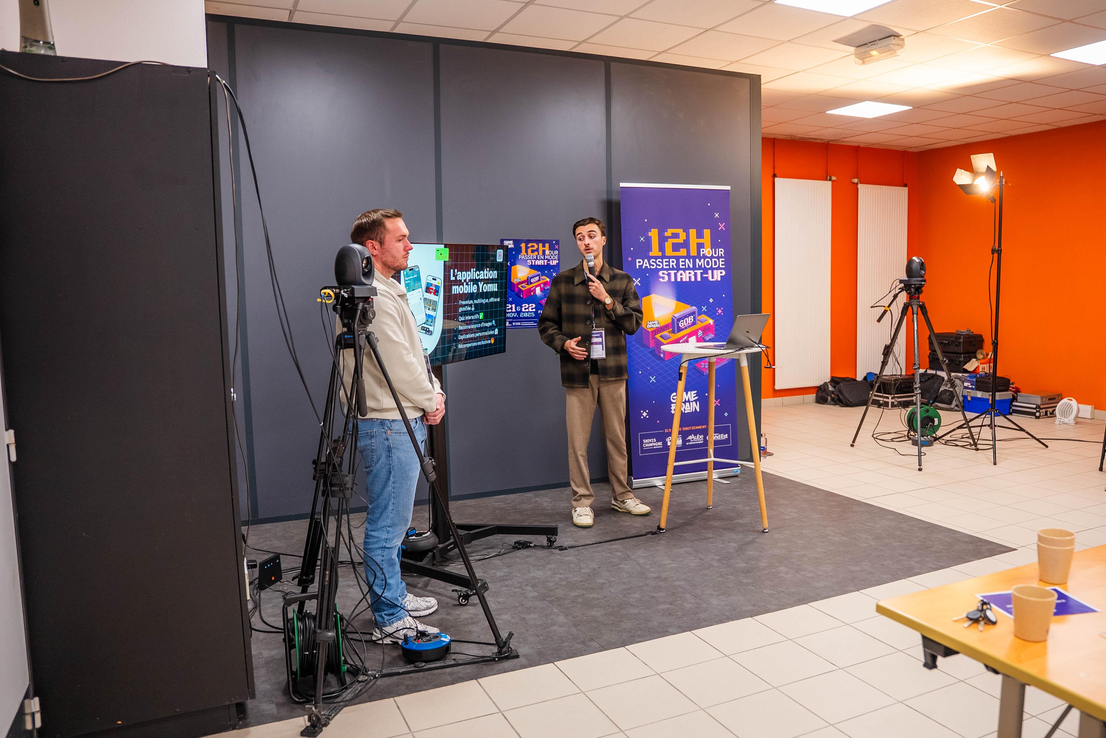 Pierre Escofet pitching YOMU on stage during the Game of Brain competition